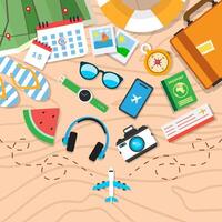 Travel items on sandy beach vector