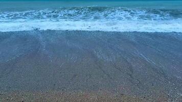 Experience the tranquil beauty of beach waves under twilight skies, perfect for relaxation and meditation. photo