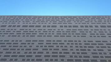 Appreciate this stunning view of a modern buildings textured facade against a vibrant blue sky, a treat for architects photo