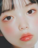 Close up of a young woman's fair face shows beauty and delicate makeup details. photo