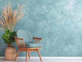 a chair and a plant in front of a blue wall photo
