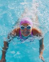 an older woman in a swimming pool photo