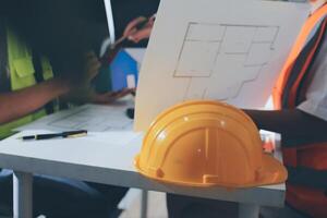 A hard hat and a construction helmet on a table photo