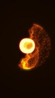 A glowing central orb with radiant yellow flares and fiery tendrils surrounded by floating golden particles in dark space video
