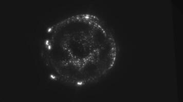 Glowing digital sphere with radiant energy particles creating an ethereal sci-fi atmosphere video