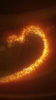 Sparkling golden particles forming a glowing heart shape on a warm radiant background video