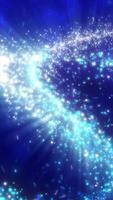 Stream of bright blue and white particles radiating through a dark space, creating a fluid starry wave video