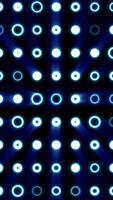 Futuristic glowing rings forming a grid of circular light patterns with radial beams on a dark background video