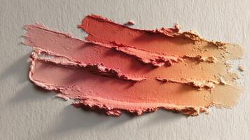 Neutral Tone Matte Clay Smear Texture With Pink and Orange Gradient Displayed Against a Textured Background for Artistic Use photo