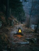 Trail Marker Glowing on Mountain Path During Twilight, Highlighting Outdoor Adventure and Exploration in Nature photo