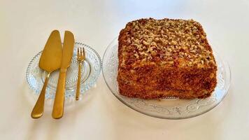 This is a delicious layered cake filled with assorted nuts, making it perfect for any celebration or special occasion video