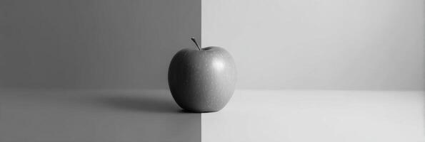Minimalist Grayscale Composition Featuring a Single Colored Apple on a Contrasting Background photo
