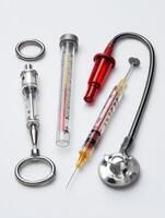 Veterinary Tools Including Syringe, Thermometer, and Stethoscope Arranged on a White Background for Animal Healthcare photo