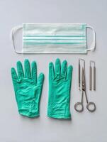Surgical Tools and Personal Protective Equipment Arranged Neatly for Medical Procedures in a Clinical Setting photo
