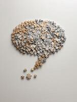 Puzzle Pieces Creating a Speech Bubble to Symbolize Teamwork and Communication in an Abstract Design With a Minimalistic Background photo