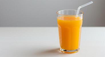 Refreshing Glass of Orange Juice on a Bright Kitchen Counter photo