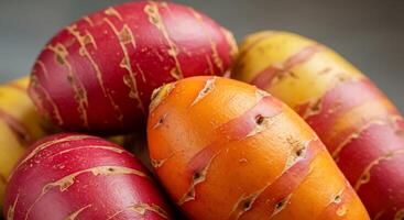Vibrant Red and Orange Oca Tubers A CloseUp View photo