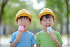 Two cheerful boys enjoying colorful ice cream cones in a sunny park on a bright day, wearing yellow safety hats photo