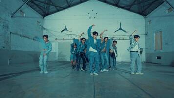 Group of young dancers practicing in a studio with urban style clothing during the night video