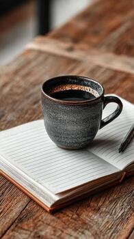 Morning Coffee With Notebook on Rustic Wooden Table in Cozy Cafe. photo