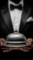 Elegant Server Presents Gourmet Dish Under Cloche at Formal Event With Refined Atmosphere. photo