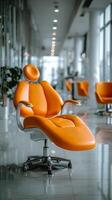 Bright Orange Reclining Chair in a Modern Dental Clinic With Sleek Design Elements photo