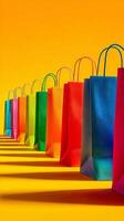 Colorful Shopping Bags Lined up Against a Bright Orange Background. photo