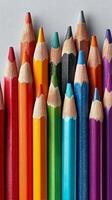 Colorful Arrangement of Sharpened Art Pencils on a Light Background photo
