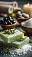 Natural Herbal Soap With Olive Oil and Rosemary Arranged Beautifully With Stones and Candles photo