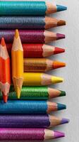 Colorful Assortment of Sharpened Colored Pencils Arranged on a Light Background. photo