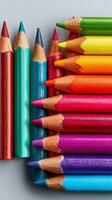 Colorful Assortment of Sharpened Colored Pencils Arranged on a Light Background photo