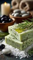 Natural Herbal Soap With Olive Oil and Rosemary Arranged Beautifully With Stones and Candles. photo