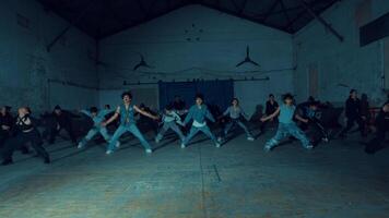 Group of people in a dimly lit, abandoned building, exploring or having an event. video