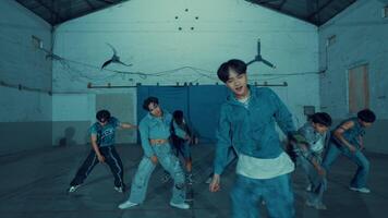 Group of young people practicing dance moves in a studio. video