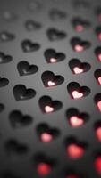 Looped animation of bright red hearts appearing on a black background. Close-up view with soft focus and seamless motion. Romantic and modern abstract design. Perfect for love or Valentine themes. video