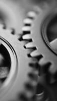 Seamless loop of interlocking metal gears in rotation. Perfect for industrial, mechanical, and engineering backgrounds or tech-themed motion graphics. video
