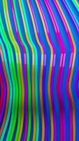 Smooth, colorful lines ripple like waves on a bright blue background. A vivid abstract animation perfect for motion graphics, design, or futuristic concepts. video