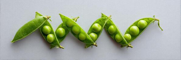 Fresh Green Peas in Vibrant Pods Arranged on a Clean Surface Highlighting Their Natural Beauty and Freshness photo
