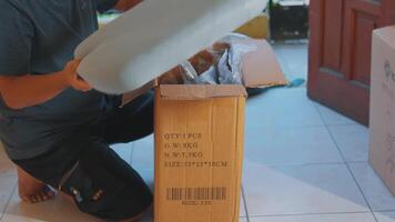 Unpacking a Cardboard Box at Home video