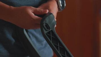 Close-up of Hands Holding a Black Tool Component video