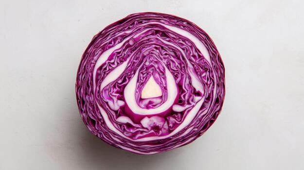 Sliced Red Cabbage Creating a Symmetrical Mandala Pattern With an Open Top View Highlighting Vibrant Colors and Textures photo