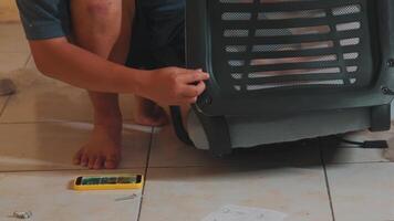 Person Assembling a Chair at Home video