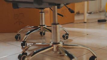 Close-up of Chrome Office Chair Base with Wheels video