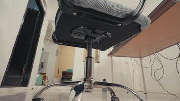 Low-Angle View of an Office Chair in a Simple Room video