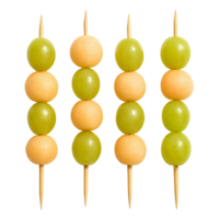 Four fruit skewers with green grapes and yellow melon balls isolated on transparent background png