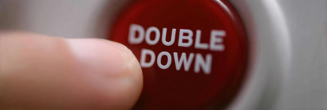 Risky Decision-Making With a Finger Hovering Over the Double Down Button on a Gaming Device During an Intense Moment of Play photo