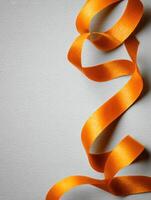 Floating Orange Zest Ribbon on a Matte Background With Upper Section Left Blank for Visual Impact photo