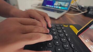 Hands Typing on Keyboard with Laptop and Tablet video