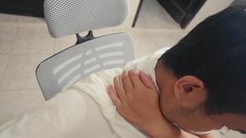Person Experiencing Shoulder Discomfort in Indoor Setting video
