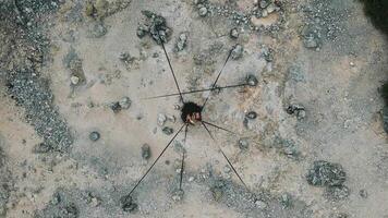 Aerial View of a Person in a Rocky Landscape with Ropes video